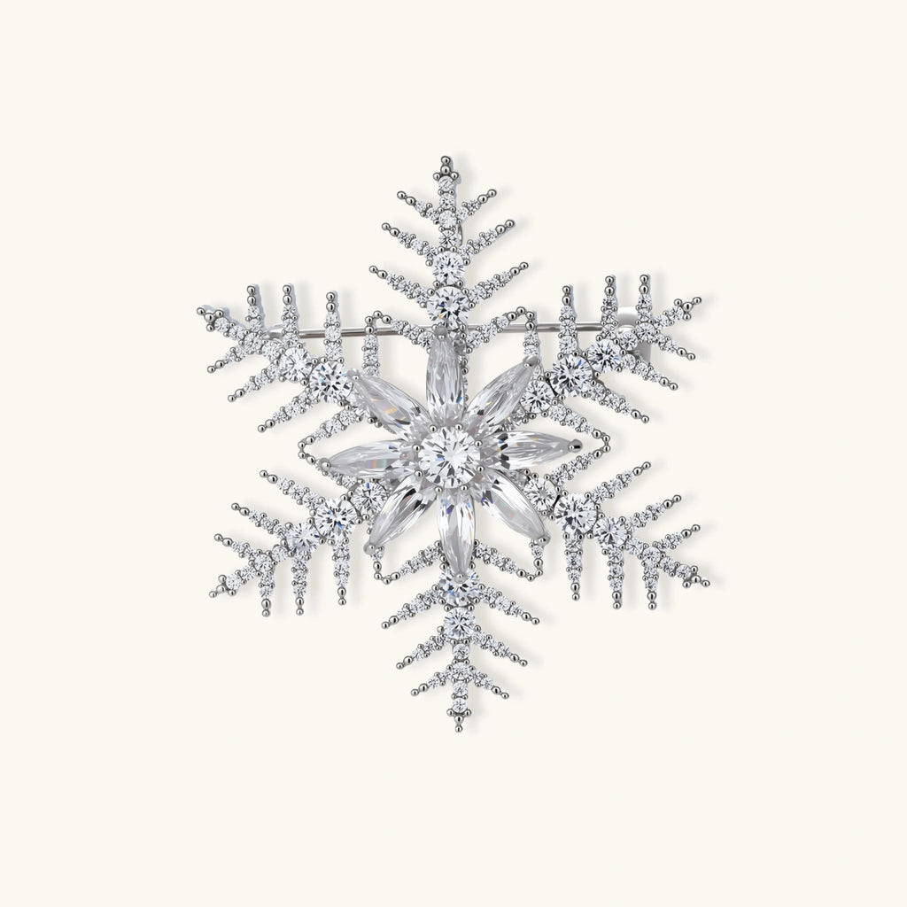 Intricate snowflake brooch with palladium-plated copper setting and sparkling zircon stones in radiating crystal pattern