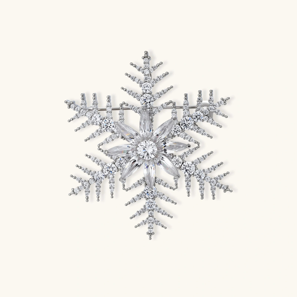 Intricate snowflake brooch with palladium-plated copper setting and sparkling zircon stones in radiating crystal pattern